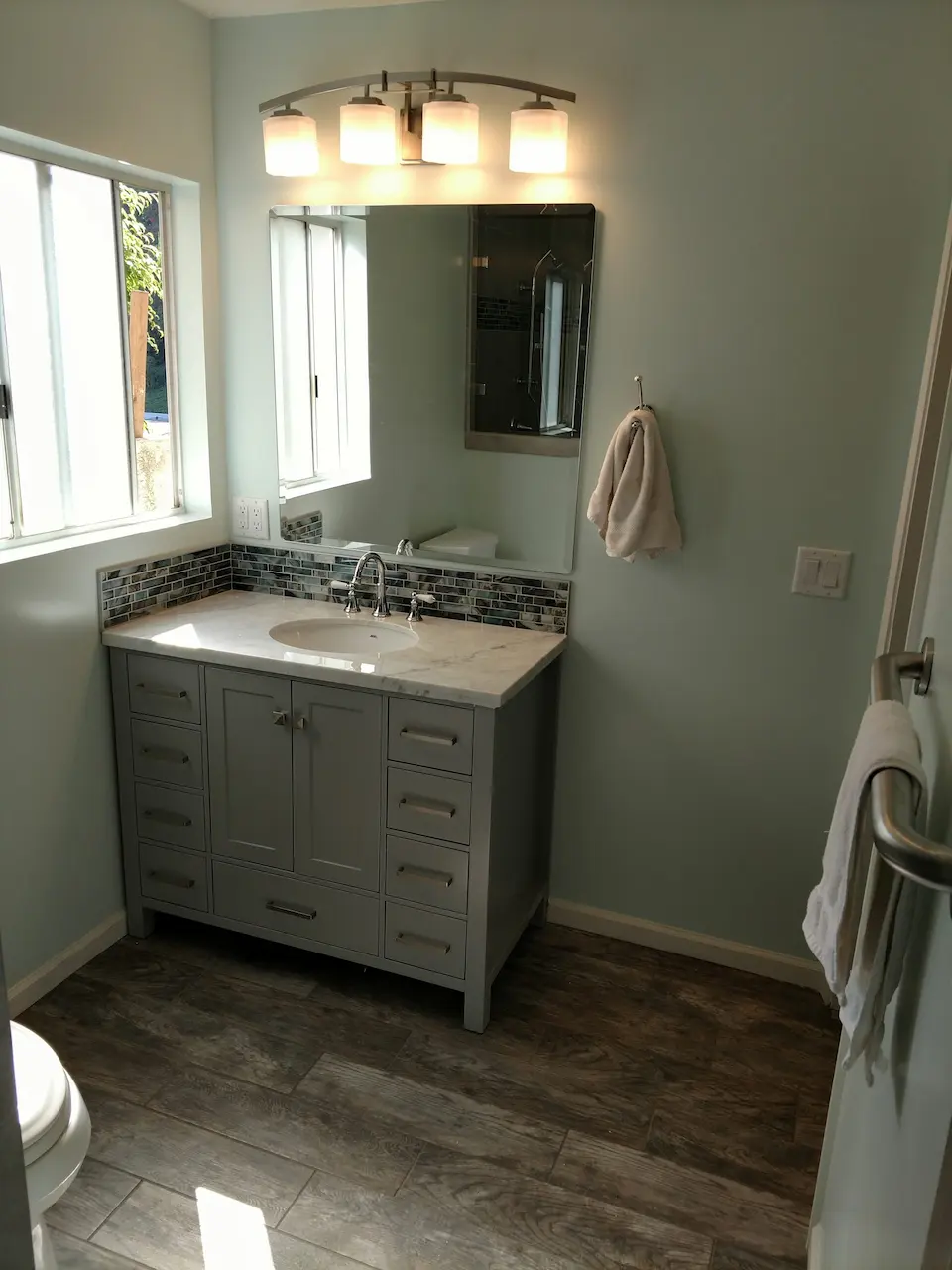 custom vanity contractor cabinet and backsplash installation custom bathroom counter upgrade