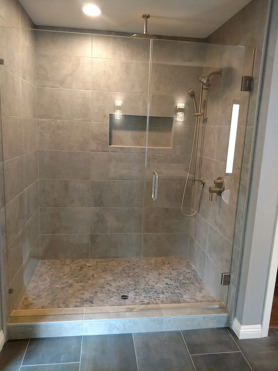 shower remodeling contractor walk-in glass shower tile floor installation custom walk-in shower upgrade